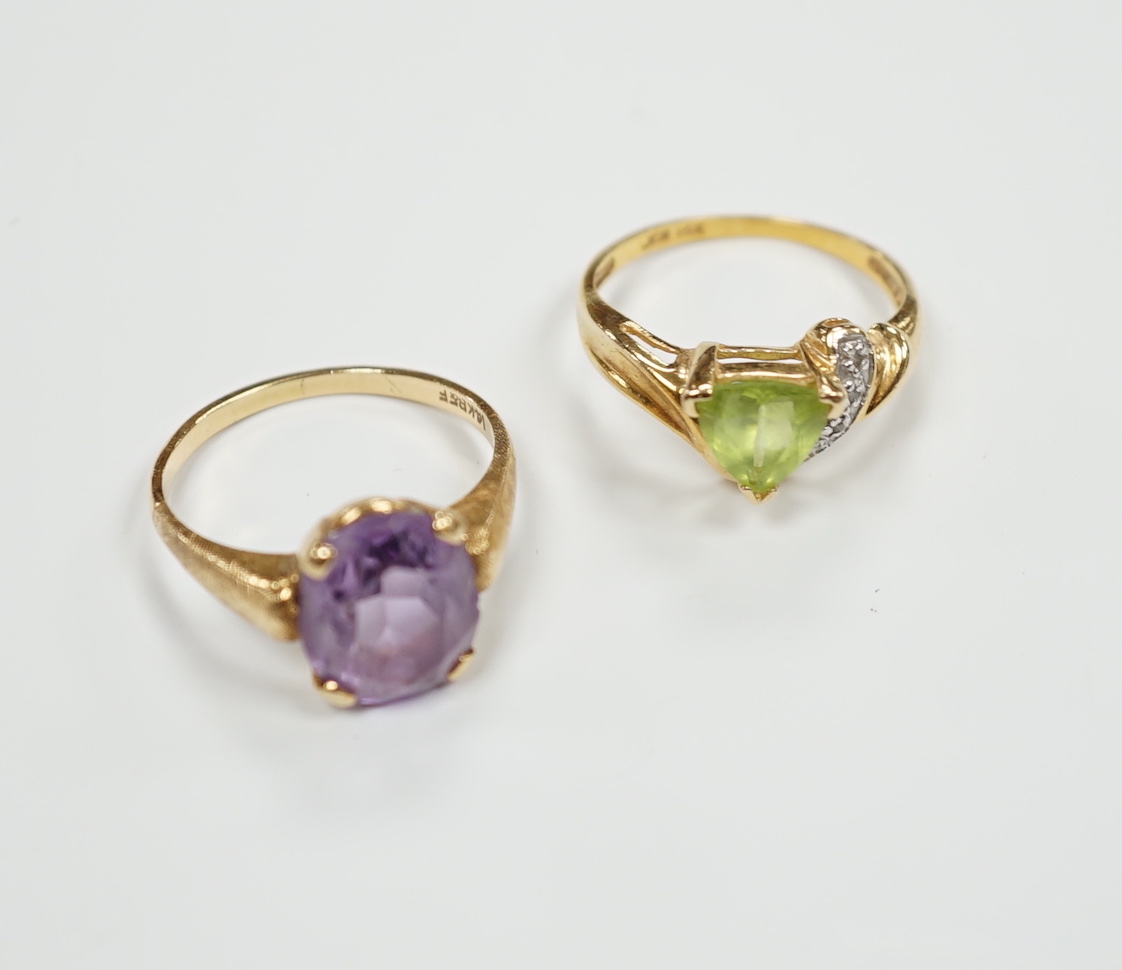 Two modern 14k and gem set dress rings, including amethyst, size P/Q, gross weight 6 grams.